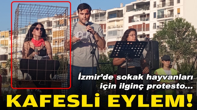 İzmir'de sokak hayvanları için ilginç protesto... Kafese girdi!